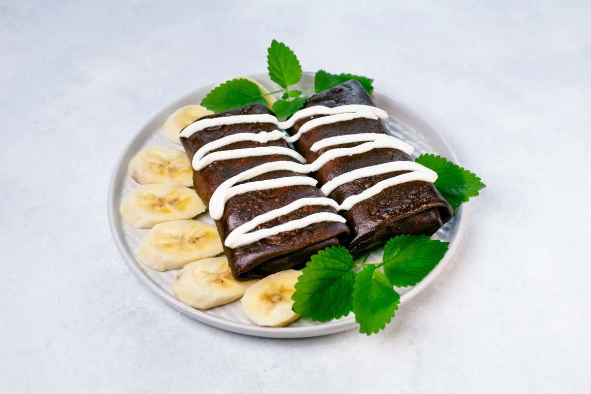 Chocolate crepes with cheese, banana, and nutella