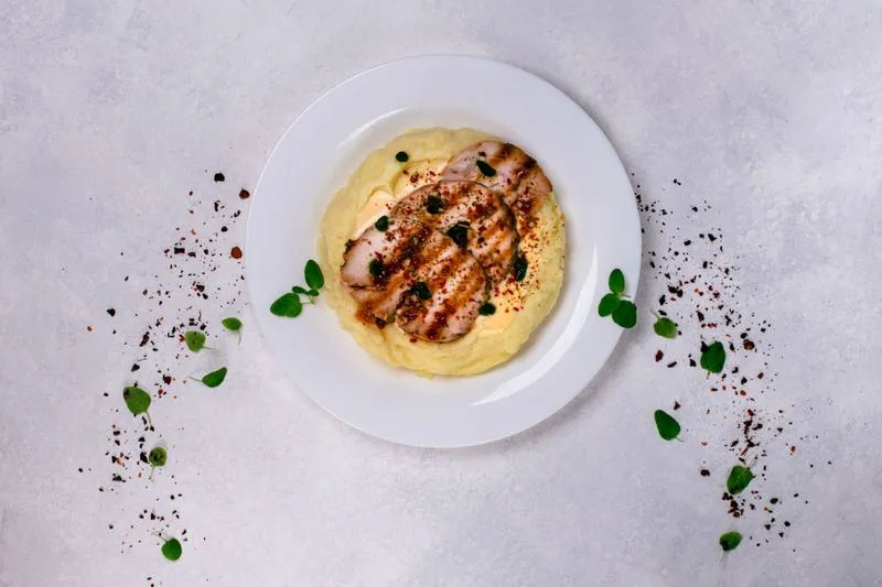 Chicken fillet with mashed potatoes and cheese sauce