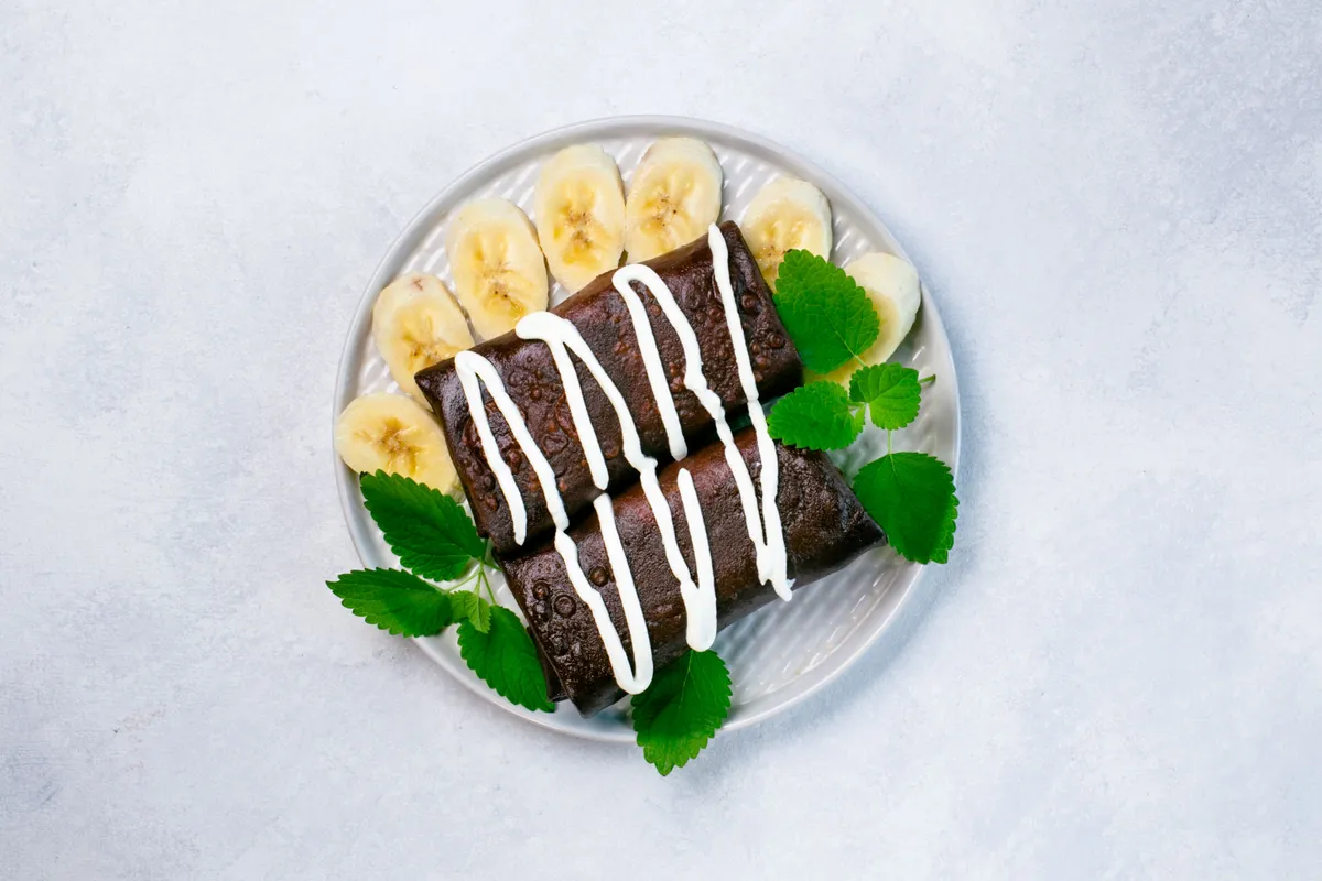 Chocolate Crepes With Cheese, Banana And Chocolate-Nut Cream